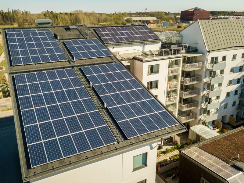 aerial-view-solar-photovoltaic-panels-roof-top-residential-building-block