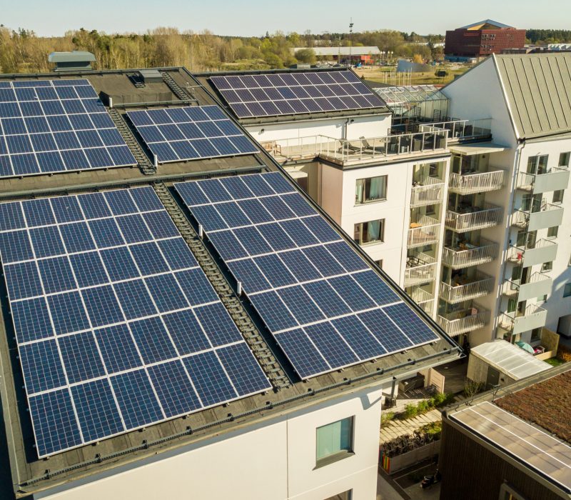 aerial-view-solar-photovoltaic-panels-roof-top-residential-building-block